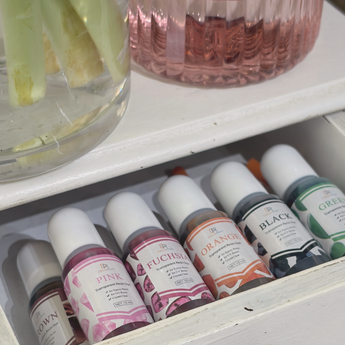 UV resin colourants in several colours to personalise the necklace background at the botanical jewellery workshop
